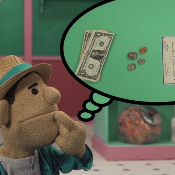 An image of Kevin, a puppet kid thinking about forms of payment